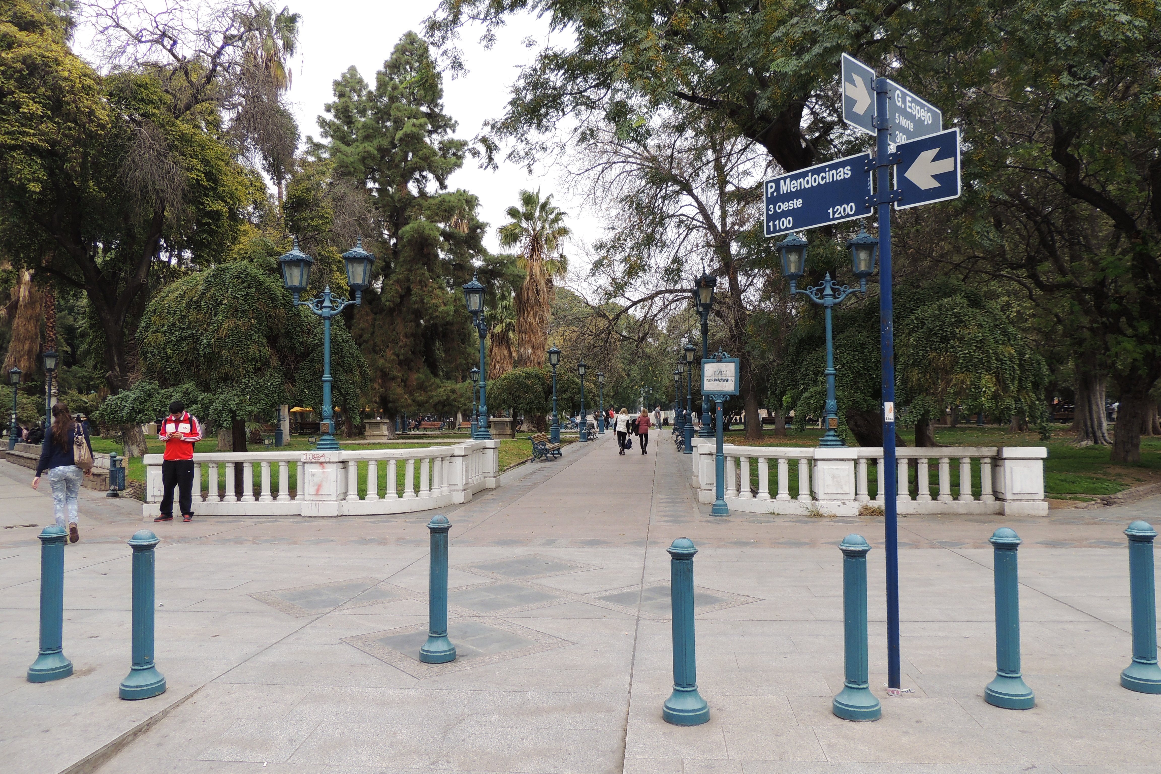 A leafy pedestrian walkway at Plaza Independencia