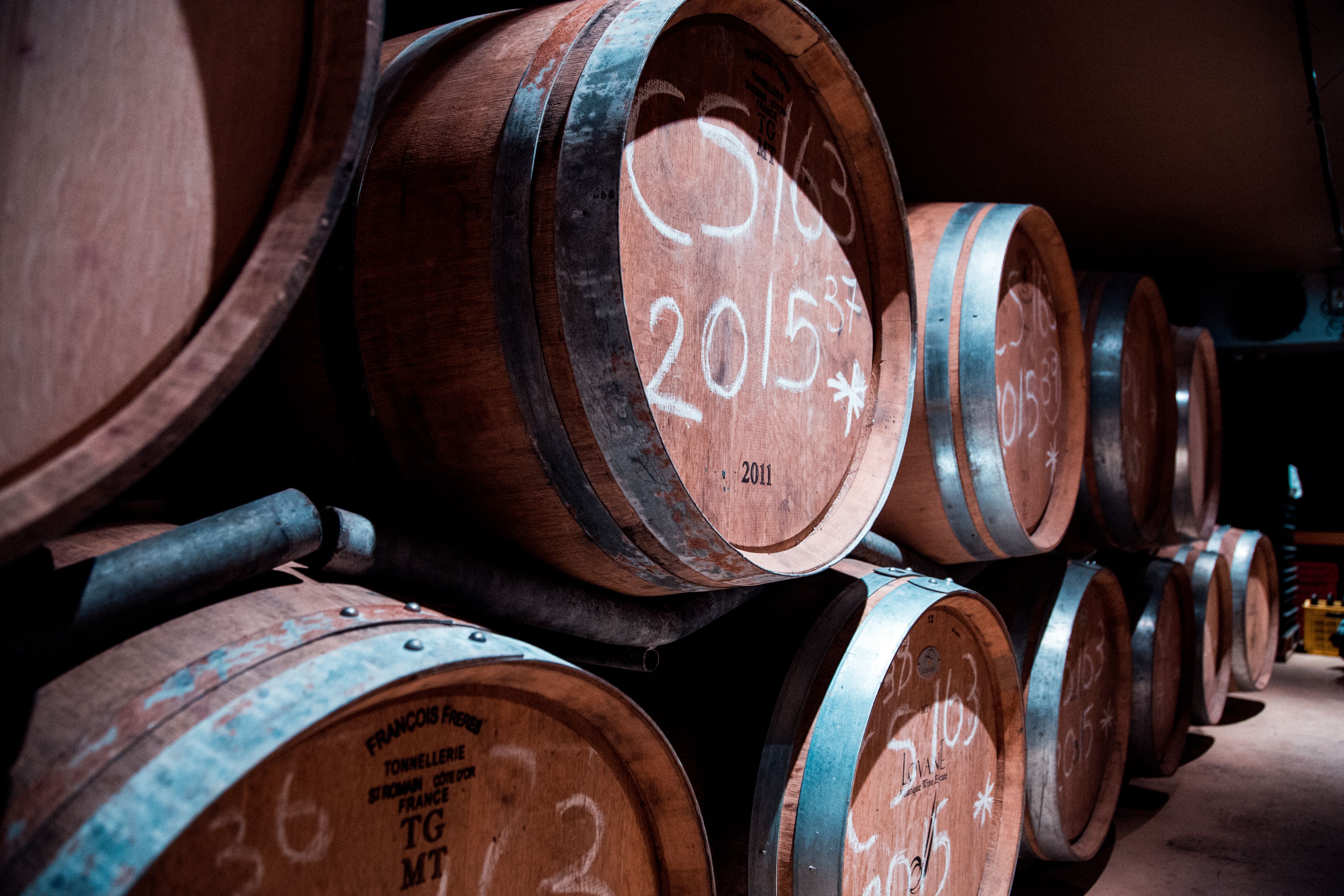 Wine barrels ageing in a Stellenbosch cellar