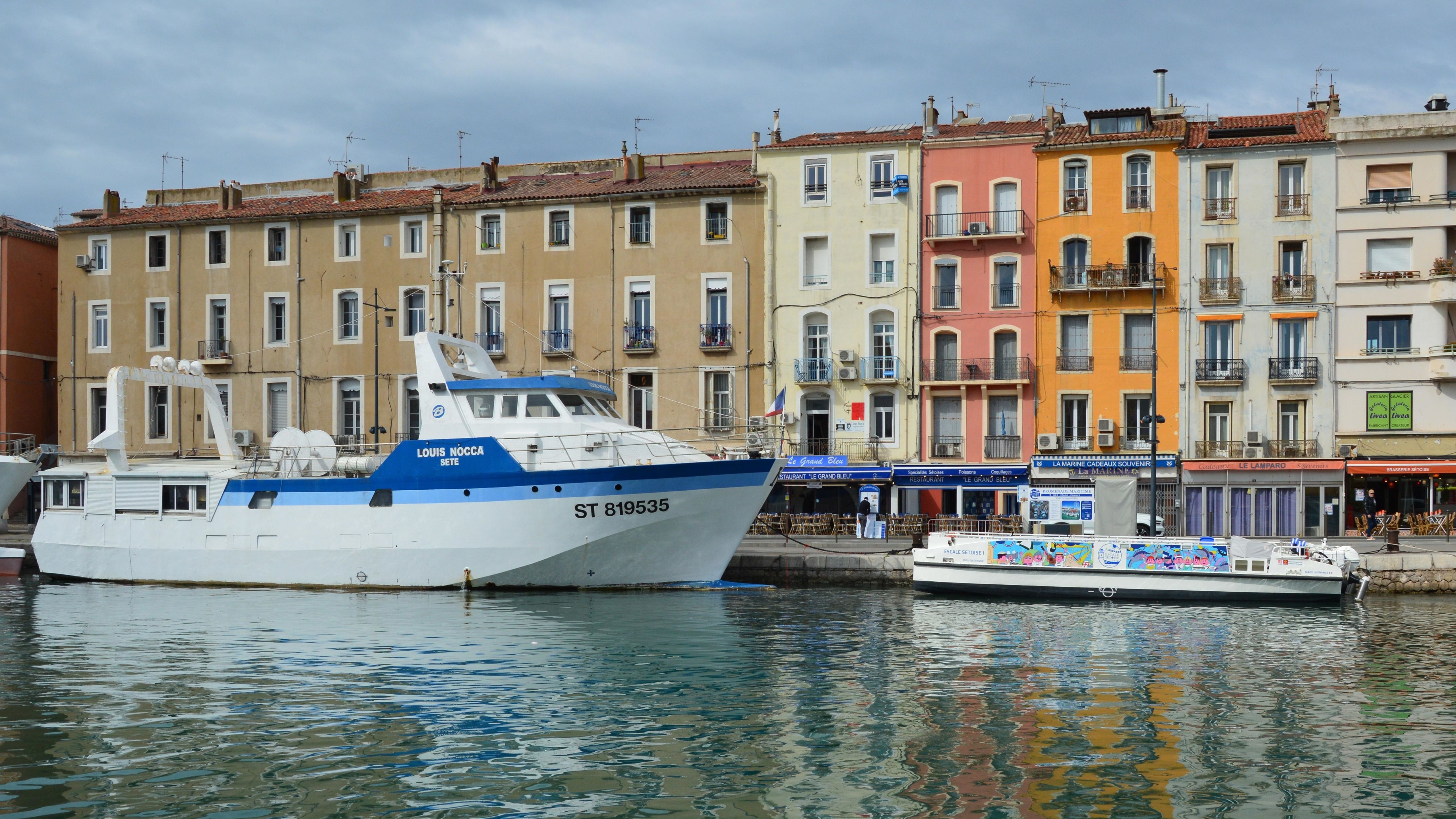 Colorful canal-side buildings and boats